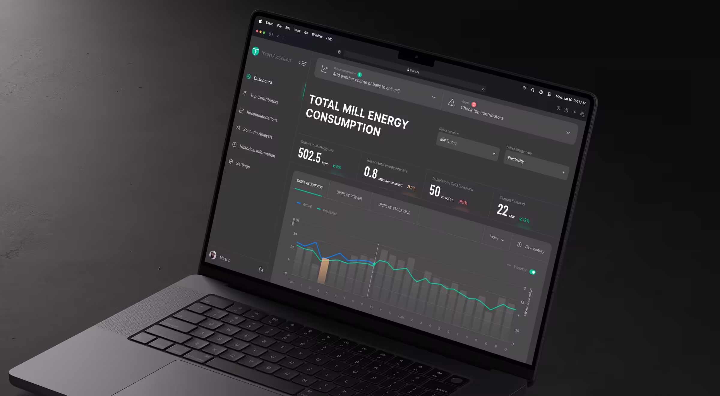 Laptop displaying an energy analytics dashboard with consumption metrics, performance charts, and monitoring tools for industrial or operational energy management.