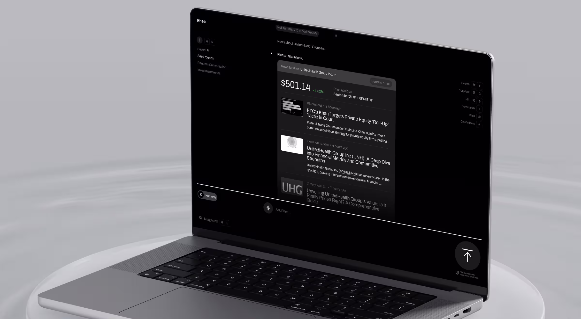 Laptop displaying Rhea’s AI research interface with real-time financial news summaries and automated insights in a dark UI
