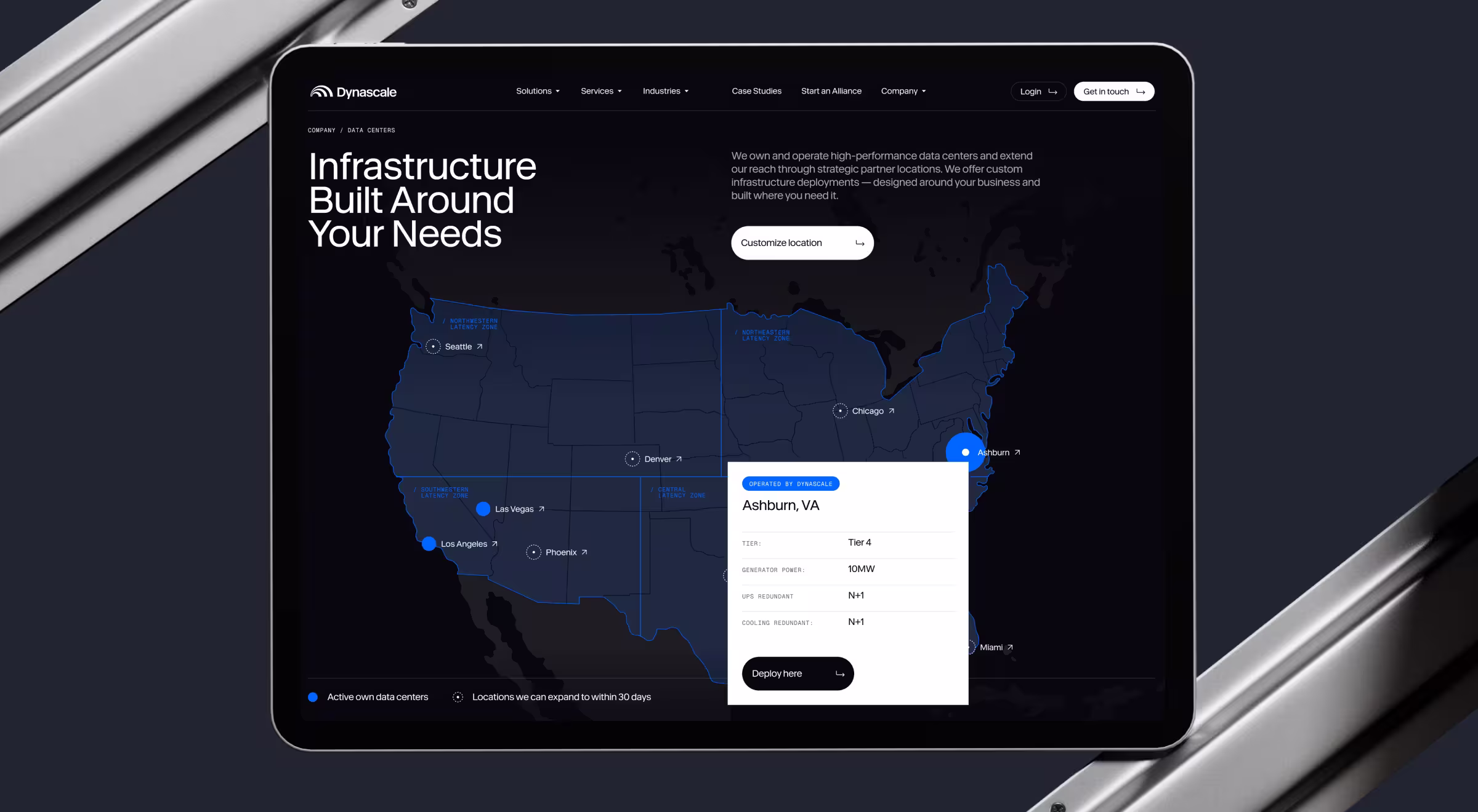 Tablet screen showing Dynascale’s data center map interface with U.S. locations, infrastructure specs, and deployment options for Ashburn, VA