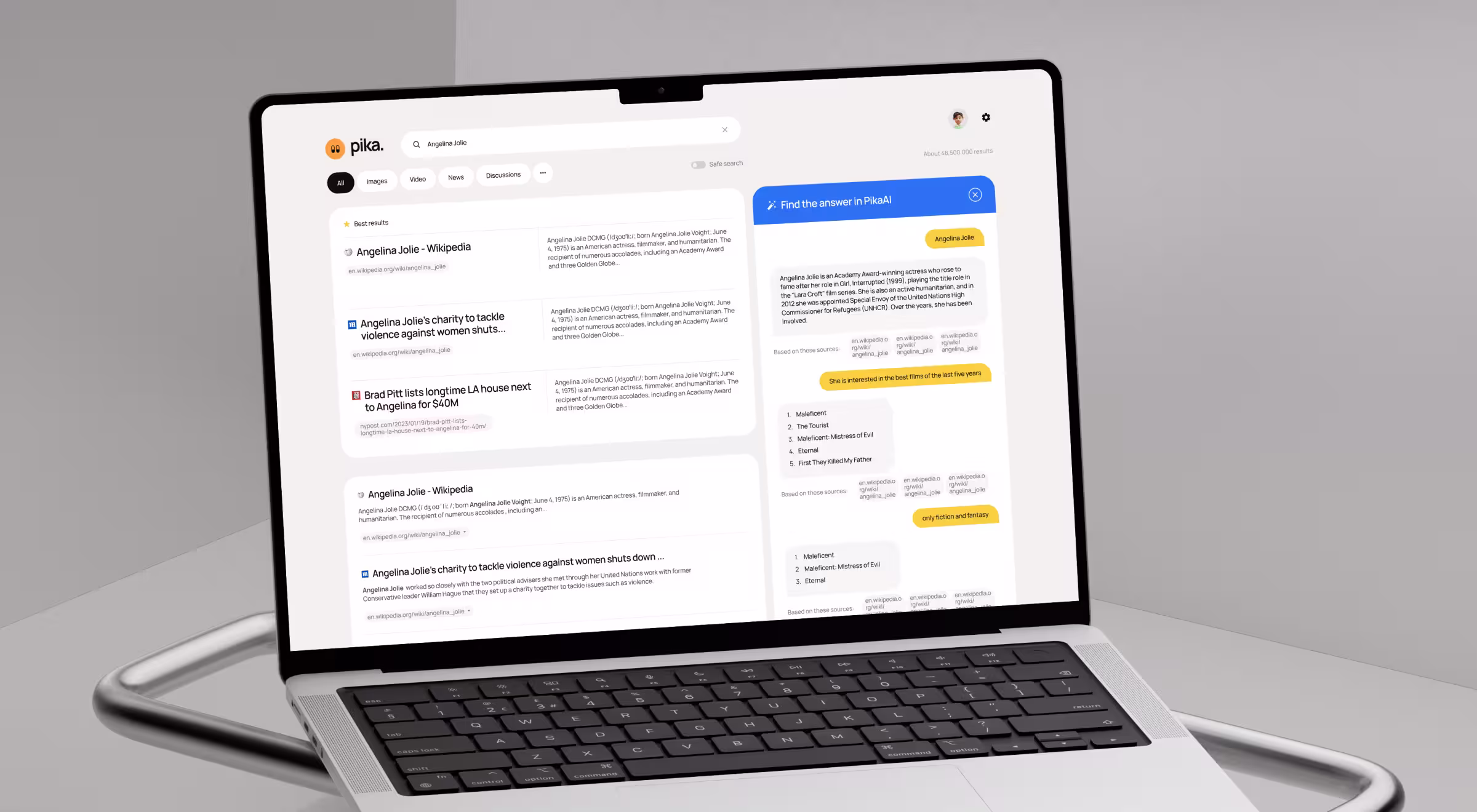 Laptop displaying an AI-powered search interface with results and an answer panel
