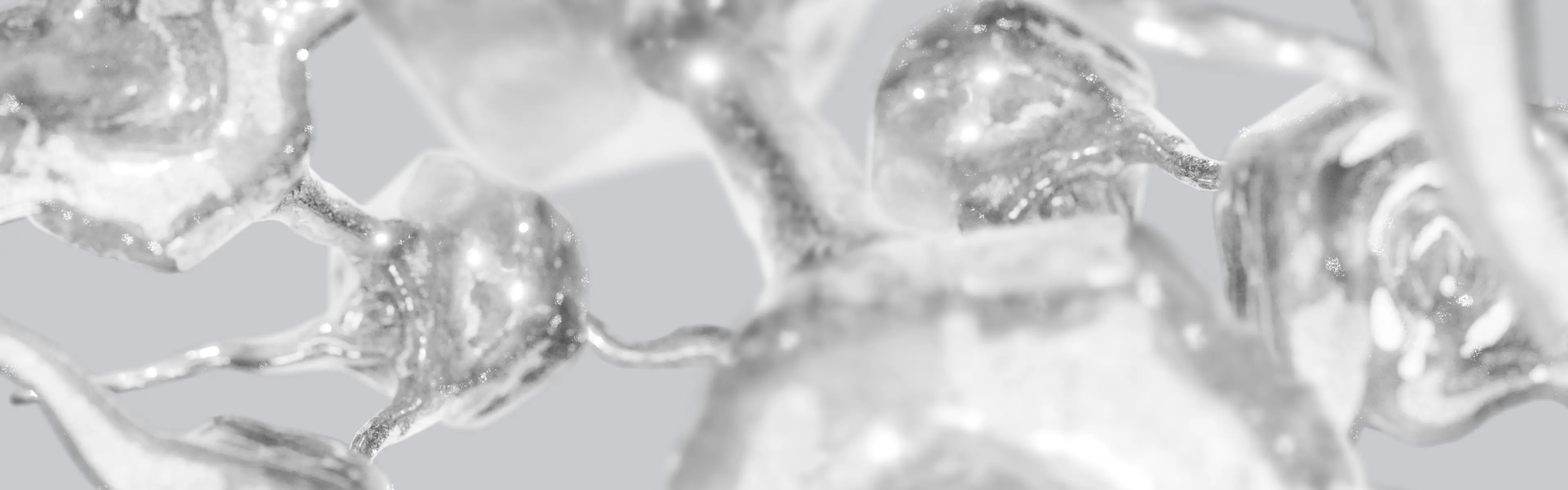 Abstract 3D render of glossy silver forms connected in a network, in soft grayscale